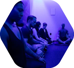 A group breathwork and meditation session in the recovery room