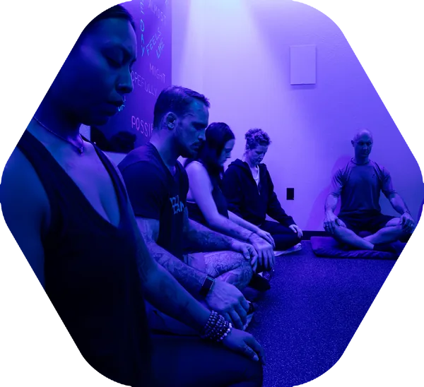 A group breathwork and meditation session in the recovery room