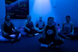 A guided group meditation in the recovery room under blue light